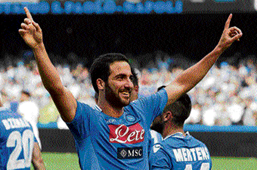 hitman: Napoli's Gonzalo Higuain celebrates after scoring against AS Roma in Seria A on Sunday. ap