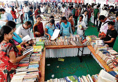 for the love of books: People skim books at Pustaka Parishe, the annual national book fair held in Basvanagudi on Sunday. dh photo