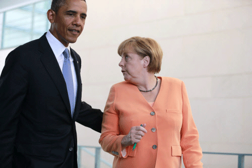 File photo of U.S. President Obama and German Chancellor Merkel at Chancellery in Berlin. Reuters