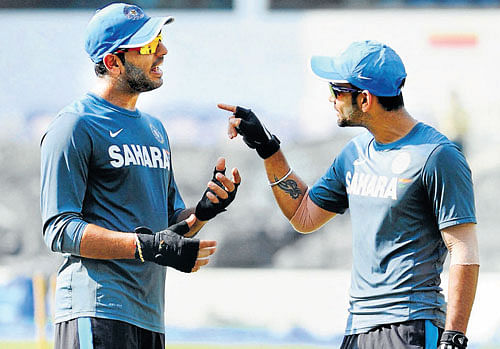 Yuvraj Singh (left) and Virat Kohli discuss a point in Nagpur on Tuesday. India play Australia in the sixth ODI on Wednesday. PTI