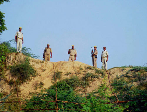 Policemen on duty during the excavation being carried out at Raja Rao Ram Bux fort in Unnao, Uttar Pradesh. PTI Photo