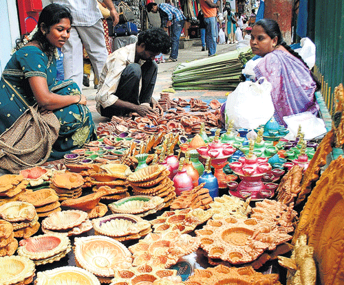 BRISK BUSINESS Vendors selling different kinds of diya  at the Malleswaram market.