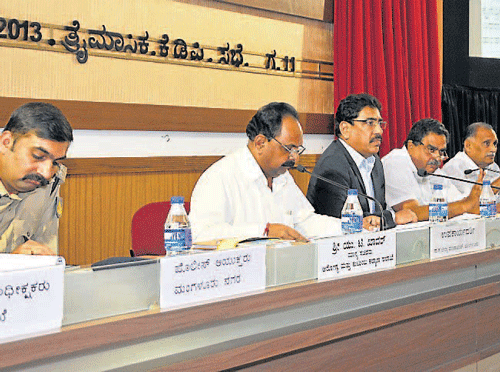 District-in-Charge Minister Ramanath Rai, Minister for Youth Services and Sports Abhayachandra Jain, DC N Prakash and others at tri-monthly KDP meeting in Mangalore on Wednesday.  DH Photo