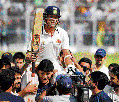 man of the hour: Sachin Tendulkar is carried by his team-mates after the Little Master guided Mumbai to a four-wicket win over Haryana on Wednesday. PTI
