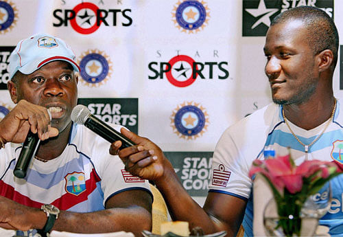 West Indies Captain Darren Sammy and Chief Coach Ottis Gibson (L)during an interaction with media in Kolkata on Wednesday. PTI Photo