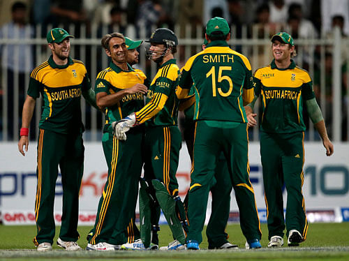 South Africa players celebrate their winning after their teammate Morne Morkel takes the last wicket of Mohammad Irfan at the end of the first one-day international cricket match between Pakistan and South Africa at the Sharjah Cricket Stadium in Sharjah , United Arab Emirates, Wednesday, Oct. 30, 2013. AP Photo