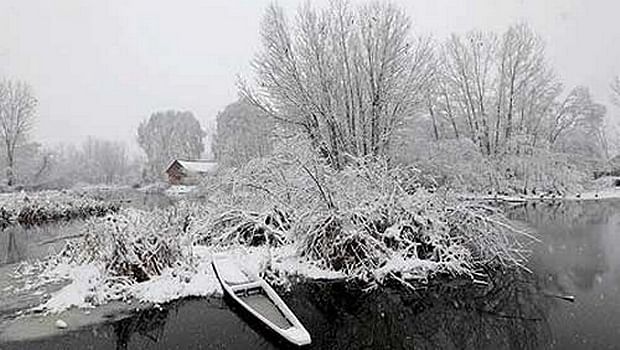 File photo - AP A boat stands covered in snow on the outskirts of Srinagar.