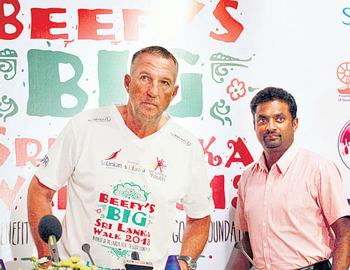 meeting of legends Ian Botham (left) and Muttiah Muralitharan during the launch of the 'Beefy's Big Sri Lanka Walk 2013' in Colombo on Thursday. ap