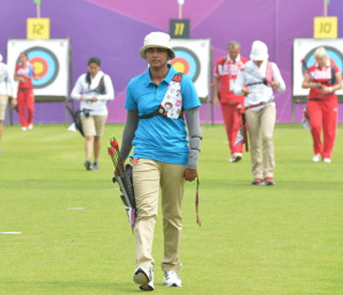 File photo of Deepika Kumari, walks back after scoring and retreiving arrows from the target during 2012 Summer Olympics. Courtesy: London Olympics