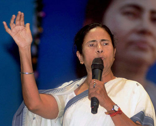 West Bengal Chief Minister Mamata Banerjee Friday urged the centre to "seriously reconsider" its decision to make Aadhaar card compulsory for getting subsidised cooking gas (LPG) and said otherwise her party members would lay siege to the Indian Oil Corporation office here. PTI File Photo.