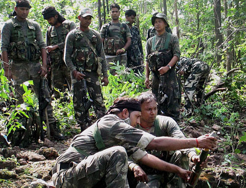 Security men reload a mortar during an encounter with Maoists in the forests of Kumandih in Latehar district on Sunday. PTI Photo