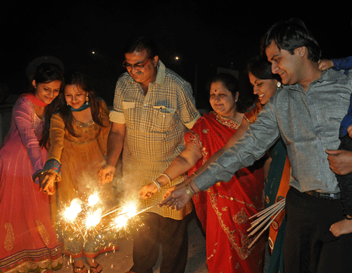 People celebrate Deepavali at Infantry Road in Bangalore on Friday. DH Photo/ S K Dinesh