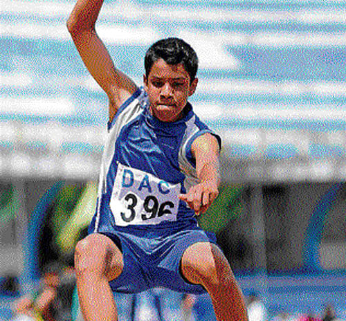 double joy Bhagawan Kripa leaps to the boys U-13 long jump gold in the DAC weekend meet on Sunday. DH photo
