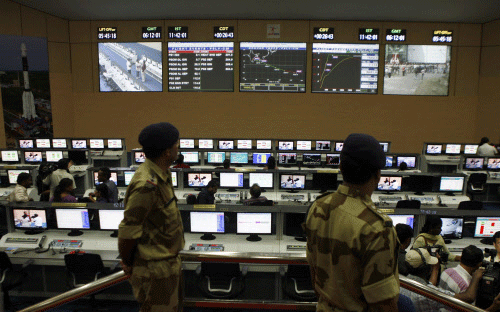Paramilitary soldiers stand guard at the control station of the Satish Dhawan Space Center at Sriharikota, in the southern Indian state of Andhra Pradesh, Wednesday, Oct. 30, 2013. India's Mars orbiter mission is scheduled to be launched by the Polar Satellite Launch Vehicle (PSLV-C25) from this center on Nov. 5. AP photo