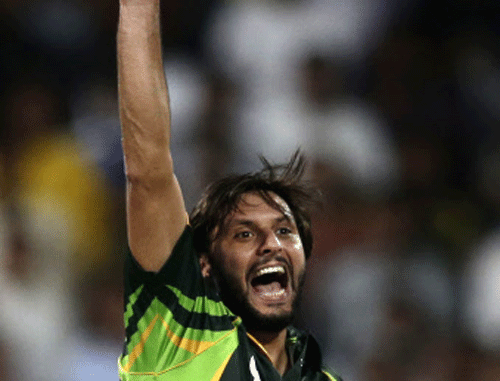 Pakistan's Shahid Afridi, celebrates taking the wicket of South Africa's Ryan McLaren during the first one-day international cricket match between Pakistan and South Africa at the Sharjah Cricket Stadium in Sharjah , United Arab Emirates, Wednesday, Oct. 30, 2013. AP photo