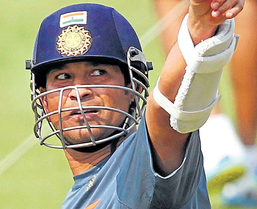 right up there: Sachin Tendulkar gestures during a practice session at the Eden Gardens on Monday. PTI