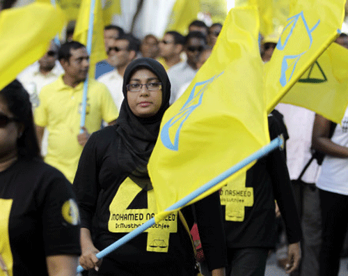 Supporters of former President Mohamed Nasheed participate in a final election campaign rally in Male, Maldives, Friday, Nov. 8, 2013. Polling for long-delayed presidential elections in Maldives began today as the archipelago nation made third attempt to elect a new President in order to avert a constitutional crisis. AP Photo.