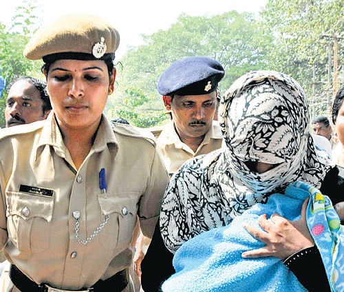 Ayesha Bano being brought to the JMFC court in Mangalore on Wednesday. dh photo