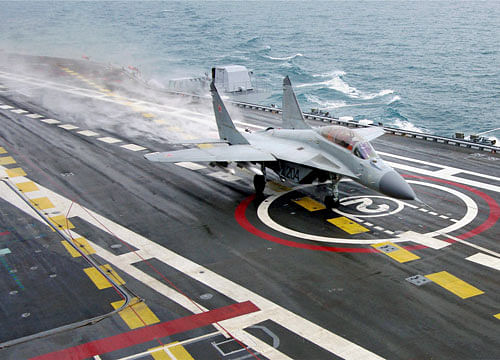 A MIG-29K fighter landing on deck of INS Vikramaditya during sailing trials at White Sea, Russia. PTI File Photo