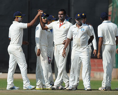 Abhimanyu Mithun of Karnataka celebrate the wicket. DH Photo