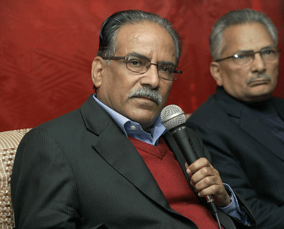 United Communist Party of Nepal Maoists leader Pushpa Kamal Dahal addresses the media in Katmandu, Nepal, Thursday, Nov. 21, 2013. The leader of Nepal's Maoist party, who appears to have lost in this week's national election, demanded Thursday that the vote counting be stopped because of what he called massive irregularities. AP photo