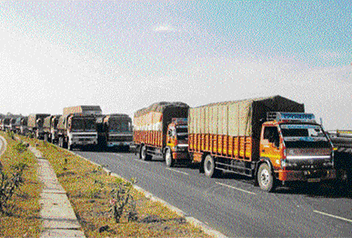 stranded: Trucks stranded on National Highway 13 as farmers blocked the road on the  outskirts of Ilkal in Bagalkot district, on Wednesday. dh photo