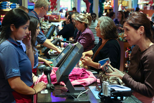 Black Friday customers make purchases at a Disney store at the Glendale Galleria in Glendale, California November 29, 2013. Black Friday, the day following the Thanksgiving Day holiday, has traditionally been the busiest shopping day in the United States.  Online US shopping for Black Friday deals soared to USD 3 billion during a two-day period beginning Thursday, with tablets and cell phones as top must-have items, estimates have shown. Reuters Photo.