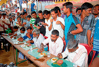 Participants of 'ragi mudde' eating contest held at Mangala village in Mandya taluk, on Sunday. DH photo