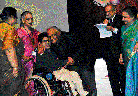 Bharat Ratna awardee C N R Rao hugs a member of the Spastics Society at the J N Tata Auditorium, IISc in the City on&#8200;Sunday.  DH photo