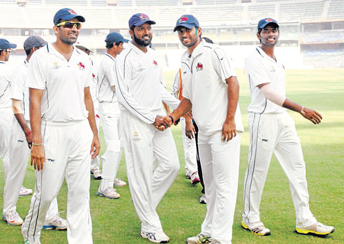 victorious Mumbai team is a happy bunch after scoring a massive 338 runs victory over Vidarbha in their Ranji Trophy match at the Wankhede stadium on Sunday. PTI