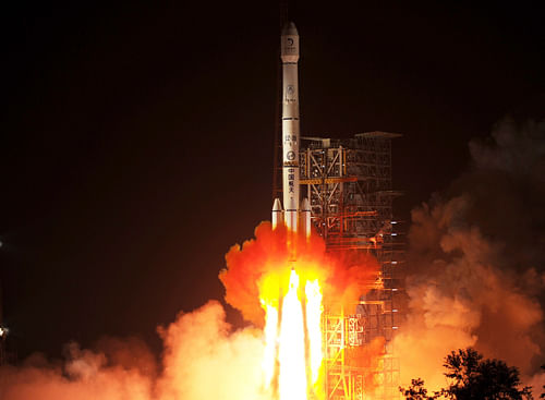 The Long March-3B rocket carrying the Chang'e-3 lunar probe blasts off from the launch pad at Xichang Satellite Launch Center. China, which successfully launched its first ever mission to land an unmanned spacecraft on the Moon, has expressed interest in space cooperation with India which has sent its first interplanetary mission to Mars. Reuters