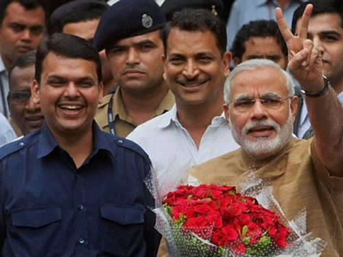 Gujarat Chief Minister Narendra Modi with Maharashtra BJP president Devendra Fadnavis. ''Congress was apprehensive of losing power to NCP in the state in case Vidarbha is carved out of Maharashtra,'' state BJP president Davendra Phadanvis said here. PTI File Photo