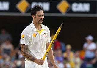 Australia's Mitchell Johnson walks off after they defeated England on the fourth day of the series-opening Ashes cricket test between England and Australia at the Gabba in Brisbane, Australia, Sunday, Nov. 24, 2013. AP photo
