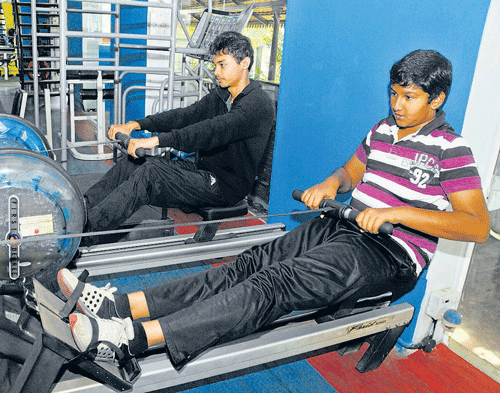 FOCUSSED: Ashiq Ahamed (right) at the gym.