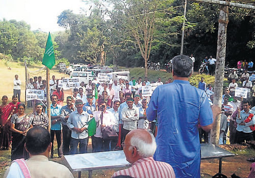 Residents stage a stir against the mini hydel power project across Kumaradhara river, at Urumbi in Puttur taluk on Thursday.