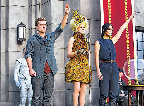 Katniss Everdeen and Peeta Mellark at the reaping for the second time.