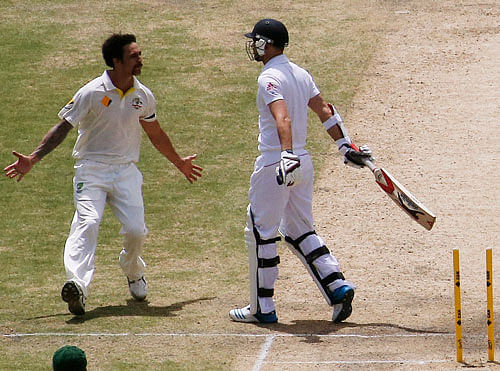 Australia's Mitchell Johnson (L) reacts to England's James Anderson after taking Anderson's wicket during the third day's play in the second Ashes cricket test at the Adelaide Oval December 7, 2013. REUTERS