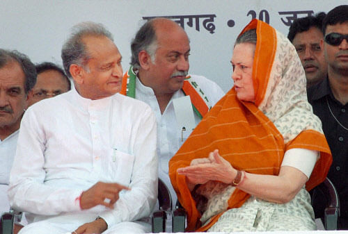 UPA Chairperson Sonia Gandhi with Rajasthan Chief Minister Ashok Gehlot at a public rally during foundation laying of two units of super critical thermal power station at Suratgarh on Thursday. PTI Photo
