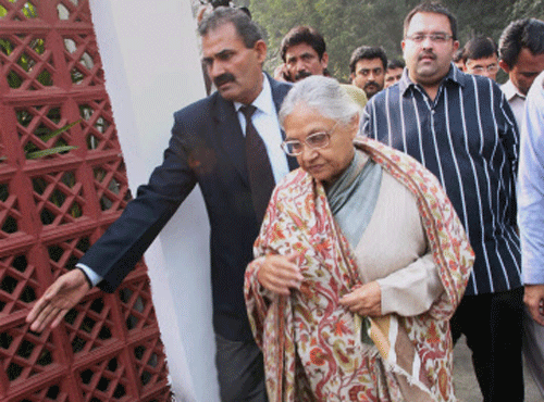 Delhi CM Sheila Dikshit arrives to address a press conference on Assembly poll results in New Delhi on Sunday. PTI Photo
