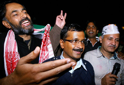 Aam Aadmi Party convener Arvind Kejriwal with Manish Sishodia and others during a press conference after party's excellent show in Delhi Assembly elections, in New Delhi on Sunday. PTI Photo