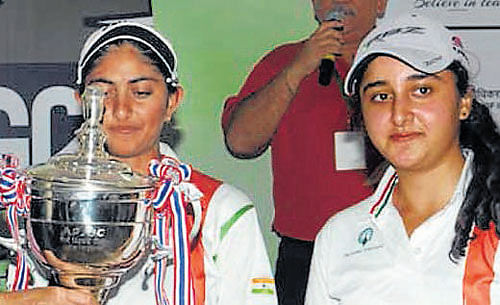 Aditi&#8200;Ashok and Ridhima Dilawari with the girls' team championship .