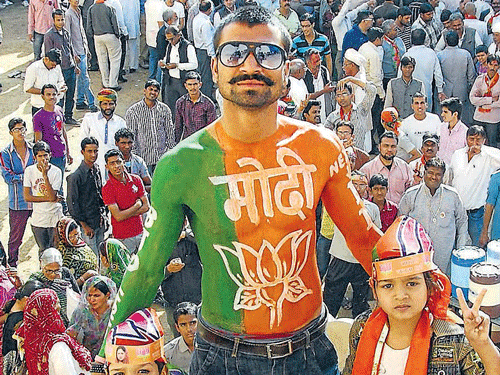 BJP supporters celebrate the party's win in Rajasthan  Assembly elections in Jodhpur on Sunday. PTI