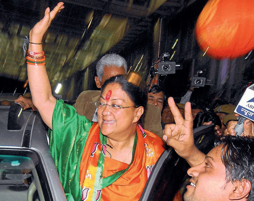 Rajasthan BJP president Vasundhara Raje waves to  supporters on her arrival at Sanganer Airport in Jaipur on Sunday. PTI