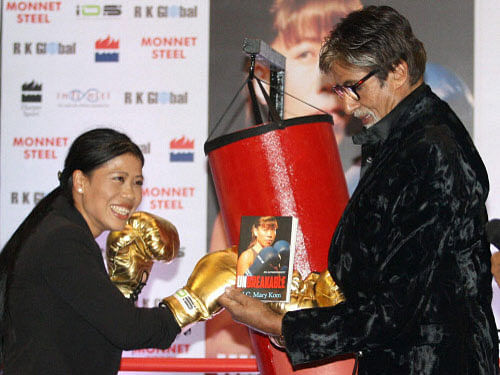 Olympic Champion boxer Mary Kom and superstar Amitabh Bachchan during the launch of her autobiography 'Unbreakable' in Mumbai on Monday night. PTI Photo