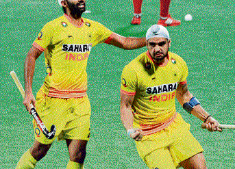 India's Gurjinder Singh (right) celebrates after scoring against Korea in the Junior World Cup on Tuesday. pti