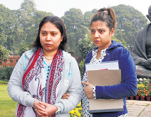 Merchant navy captain Sunil James' wife Aditi James (L) and sister Anvi at the Parliament house in New Delhi on Tuesday.  PTI