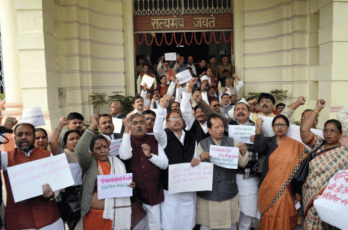 BJP MLAs holding a protest at Bihar Assembly during its winter session in Patna on Tuesday. PTI Photo