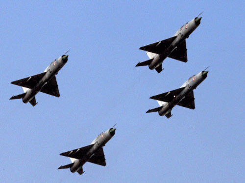 Four MiG-21 FL aircraft flying for the one last time during the 'phasing out ceremony' at the Kalaikunda Air Force Station in Midnapore district on Wednesday. PTI Photo by Swapan Mahapatra