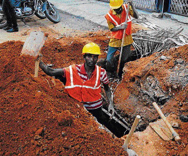 shoddy job A road being dug up in front of a house in Jayanagar. DH photo