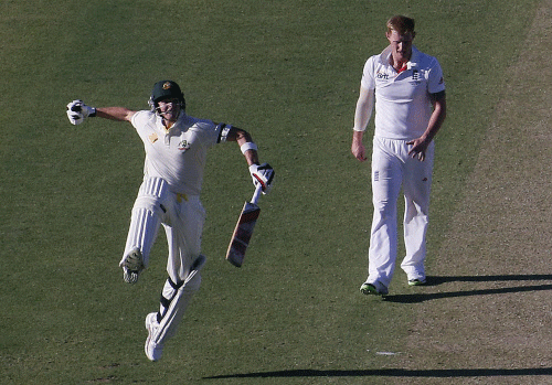 Australia's Steve Smith (L) celebrates reaching his century as England's Ben Stokes looks on during the first day of the third Ashes cricket test at the WACA ground in Perth December 13, 2013. REUTERS
